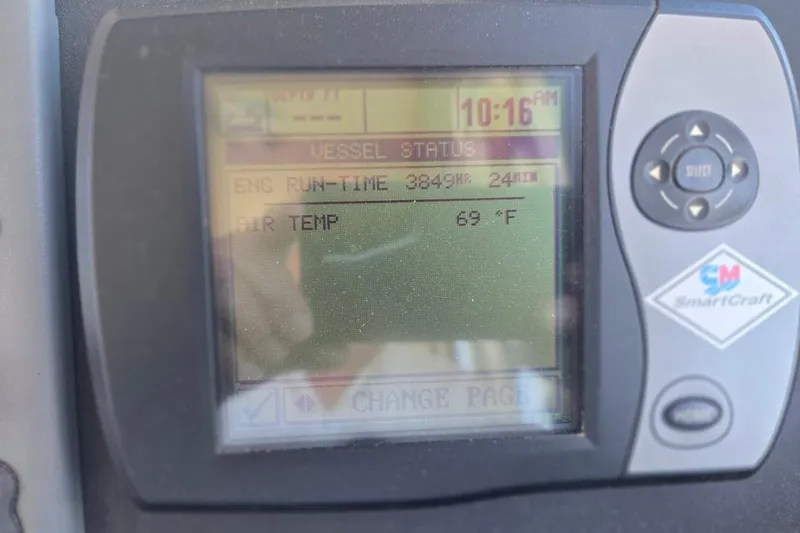 Slide: The Image of Display screen of a 2005 American Tug 34 Pilothouse showing engine runtime and air temperature. - 52