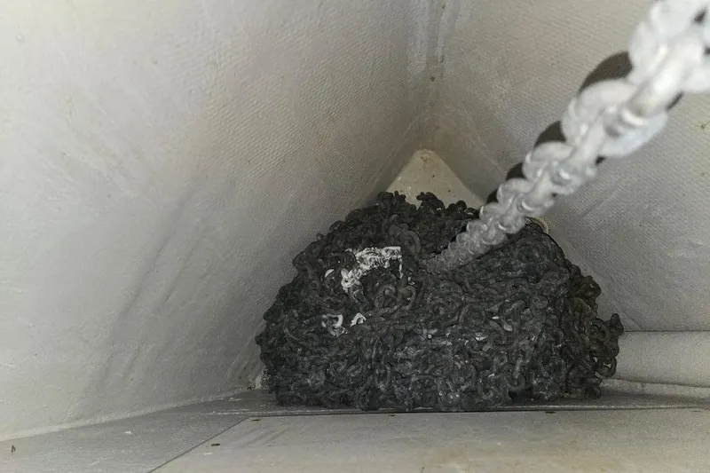 Slide: The Image of Anchor chain in the compartment of a 2005 American Tug 34 Pilothouse boat. - 73