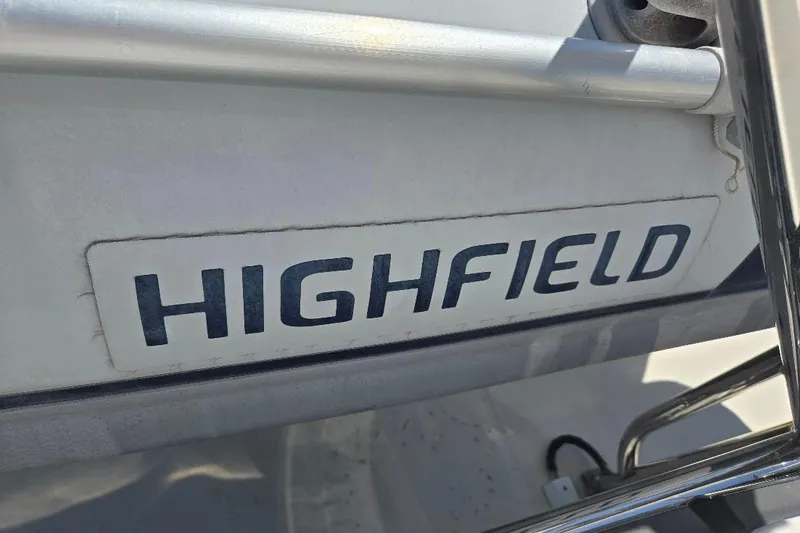 Slide: The Image of Close-up of "HIGHFIELD" logo on a 2005 American Tug 34 Pilothouse boat. - 79