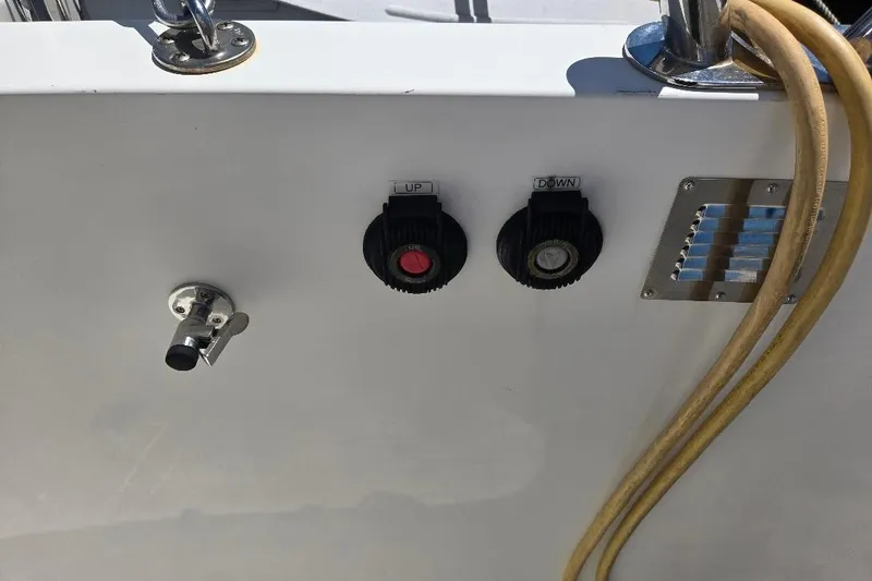 Slide: The Image of Control panel on 2005 American Tug 34 Pilothouse with switches and hose connection. - 80