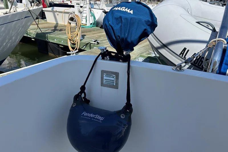 Slide: The Image of FenderStep and Magma grill cover on 2005 American Tug 34 Pilothouse boat. - 82