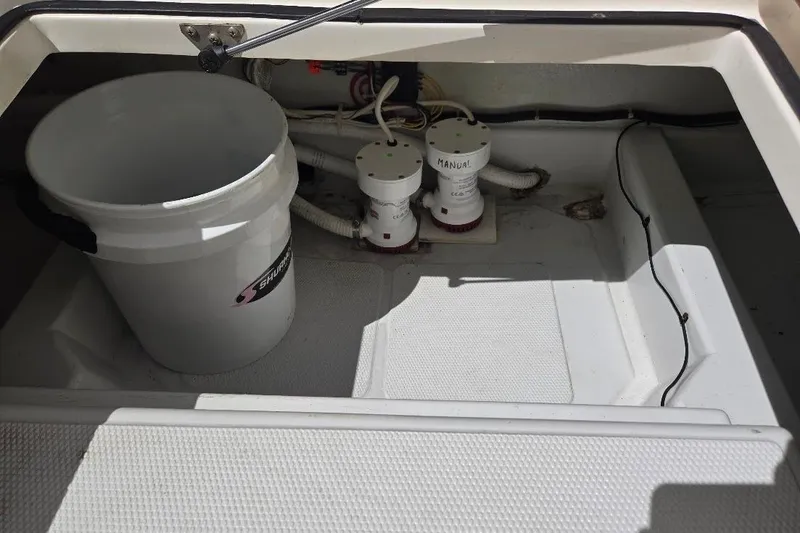 Slide: The Image of Bilge area of 2005 American Tug 34 Pilothouse with bucket and manual pumps. - 88