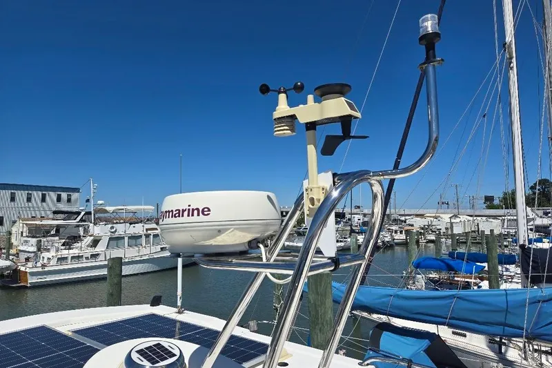Slide: The Image of 2005 American Tug 34 Pilothouse with radar and solar panels at marina. - 93