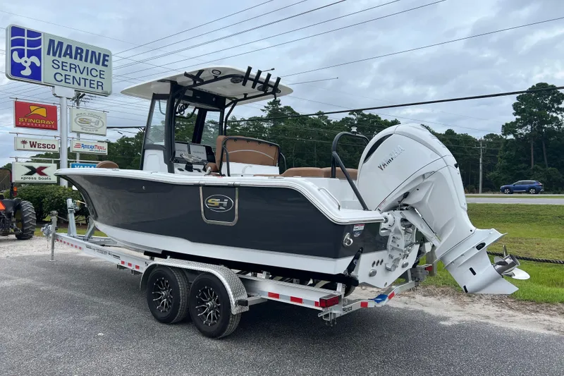 Slide: The Image of 2026 Sea Hunt Ultra 255 SE boat on trailer at Marine Service Center. - 2