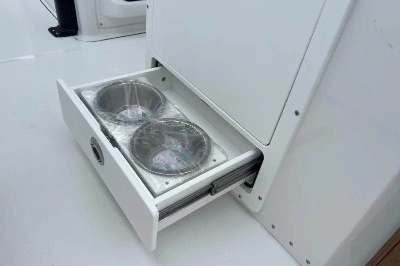 Slide: The Image of Pull-out drawer with two stainless steel bowls on Sea Hunt Ultra 255 SE, 2026 model. - 23