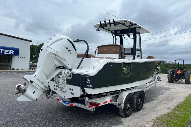 Slide: The Image of 2026 Sea Hunt Ultra 255 SE boat on trailer, featuring Yamaha outboard motor. - 5