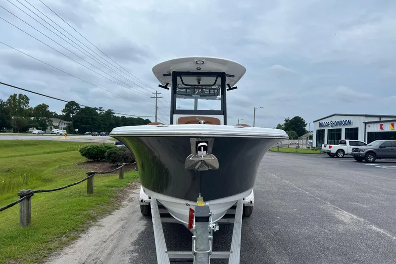 Slide: The Image of 2026 Sea Hunt Ultra 255 SE boat on trailer in parking lot, overcast sky. - 6
