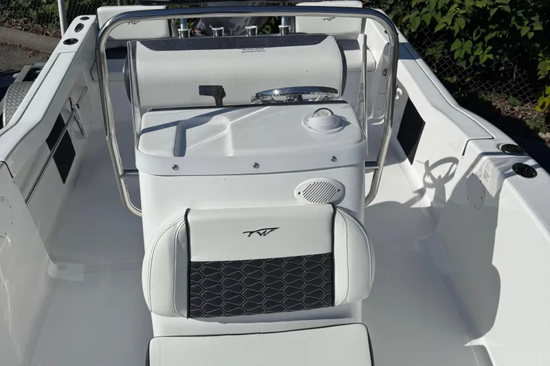 Slide: The Image of 2026 Tidewater 180CC boat dashboard with Garmin display and control panel. - 10