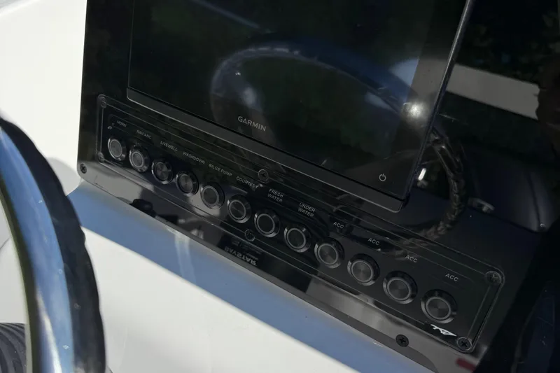 Slide: The Image of Steering wheel of 2026 Tidewater 180CC boat, featuring sleek chrome design. - 12