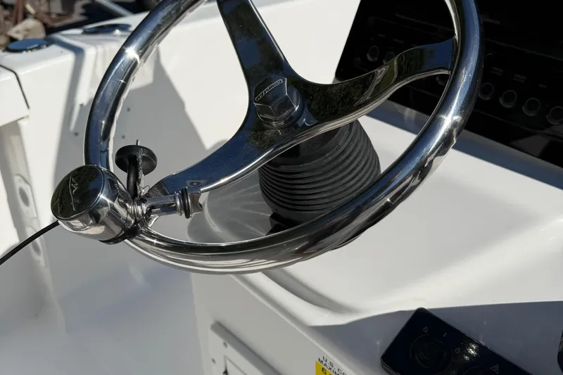 Slide: The Image of Storage compartment of 2026 Tidewater 180CC boat with wiring and equipment. - 14