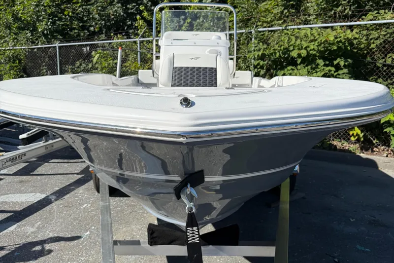 Slide: The Image of 2026 Tidewater 180CC boat on trailer, front view, outdoors. - 2