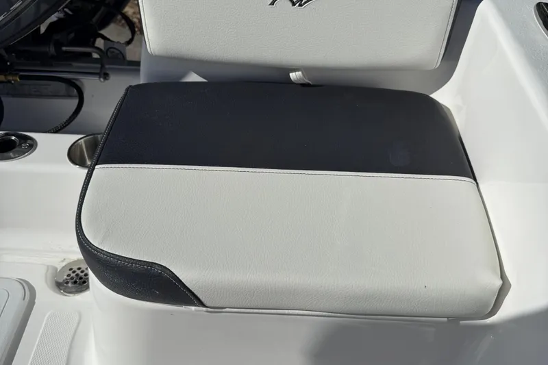 Slide: The Image of Tidewater 180CC 2026 boat detail showing cup holders and drainage system. - 22