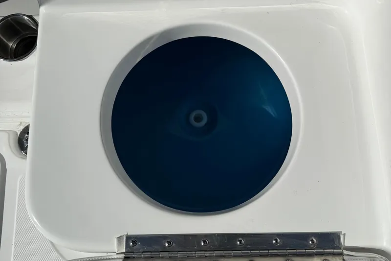 Slide: The Image of Livewell on 2026 Tidewater 180CC boat, featuring a circular blue interior. - 23