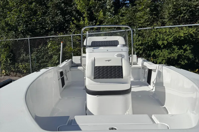 Slide: The Image of 2026 Tidewater 180CC boat rear view with Yamaha engine in a marina setting. - 6