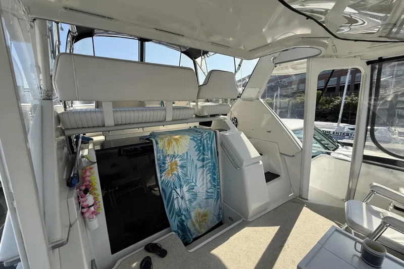 Slide: The Image of Interior of 1993 Carver 350 Motor Yacht with seating and tropical towel. - 8