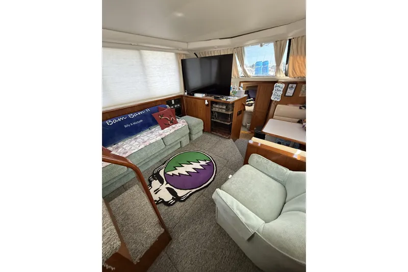 Slide: The Image of Interior of 1993 Carver 350 Motor Yacht with cozy seating and entertainment area. - 9