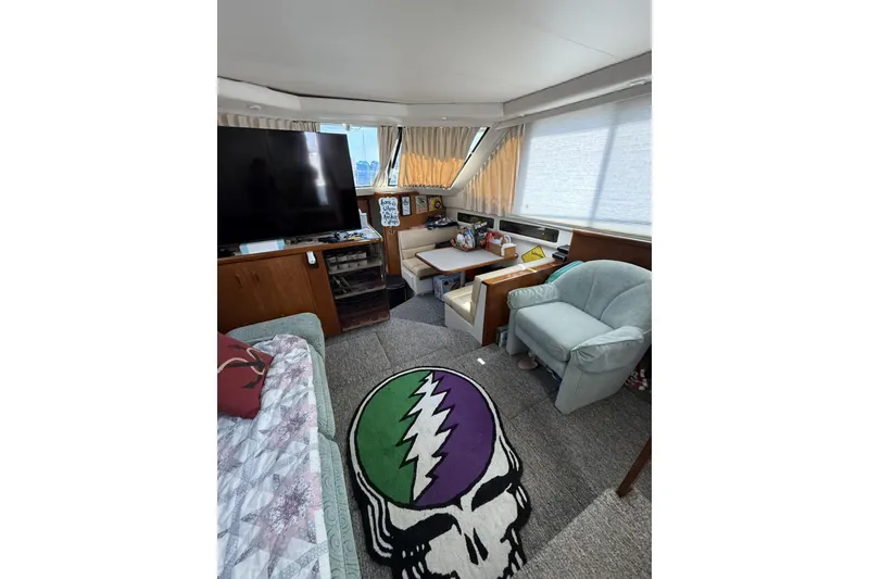 Slide: The Image of Interior of 1993 Carver 350 Motor Yacht with cozy seating and unique decor. - 10