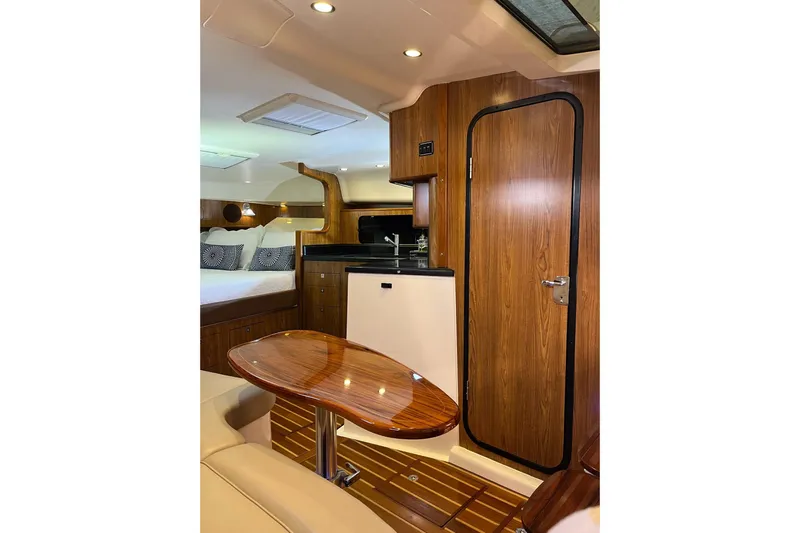 Slide: The Image of Luxurious 2009 Pursuit OS 375 Offshore cabin interior with wood finishes and modern amenities. - 15