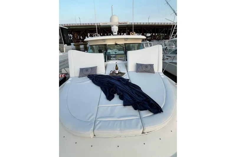 Slide: The Image of 2009 Pursuit OS 375 Offshore yacht with luxurious deck seating and elegant decor. - 18