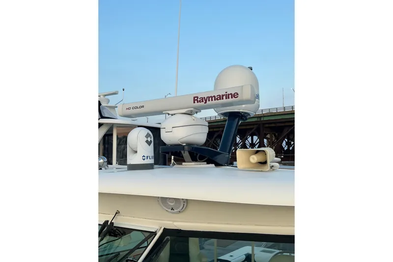 Slide: The Image of 2009 Pursuit OS 375 Offshore boat with Raymarine radar and FLIR camera on deck. - 19