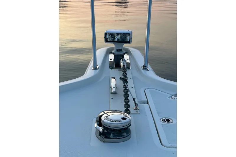 Slide: The Image of Bow of 2009 Pursuit OS 375 Offshore boat with anchor chain and winch. - 22