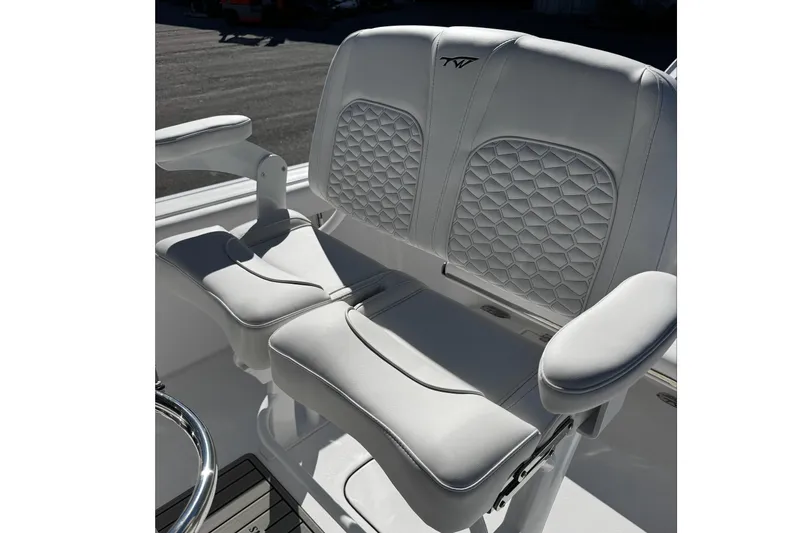 Slide: The Image of 2026 Tidewater 232 CC Adventure boat seats with elegant white upholstery and geometric pattern. - 20