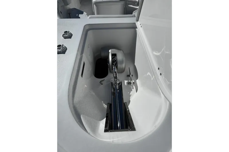 Slide: The Image of Anchor compartment of 2026 Tidewater 232 CC Adventure boat, showcasing sleek design. - 23