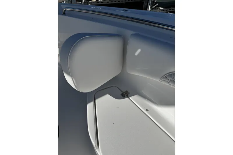 Slide: The Image of Interior detail of 2026 Tidewater 232 CC Adventure boat, featuring seating and speaker. - 25