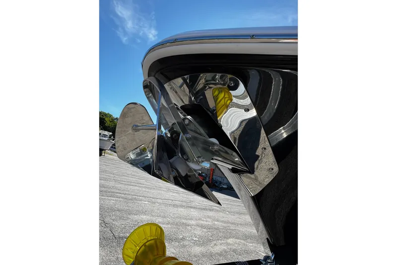 Slide: The Image of Close-up of 2026 Tidewater 232 CC Adventure boat propeller, reflecting sunlight. - 26