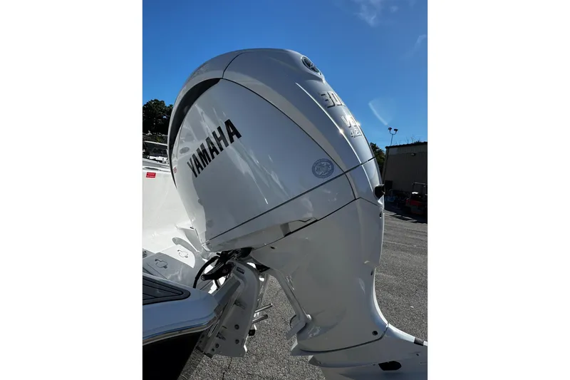 Slide: The Image of 2026 Tidewater 232 CC Adventure boat with Yamaha V6 engine, rear view. - 9