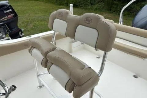 Slide: The Image of 2018 Key West 239 FS boat seating with beige and white cushions. - 13