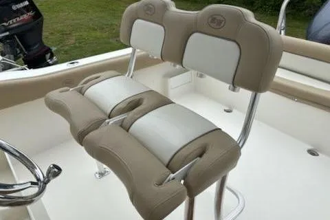 Slide: The Image of 2018 Key West 239 FS boat with beige and white cushioned seating. - 14