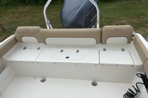 Slide: The Image of 2018 Key West 239 FS boat interior with seating and storage compartments. - 5