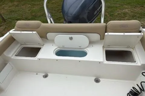 Slide: The Image of 2018 Key West 239 FS boat with open storage compartments and seating. - 6