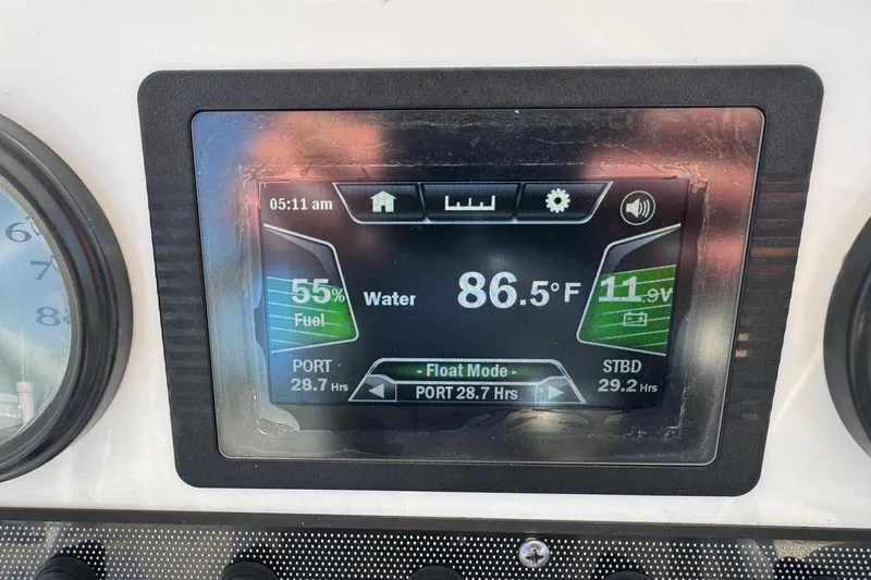 Slide: The Image of Dashboard display of 2018 Yamaha Boats 210 FSH showing fuel, water temperature, and battery status. - 16