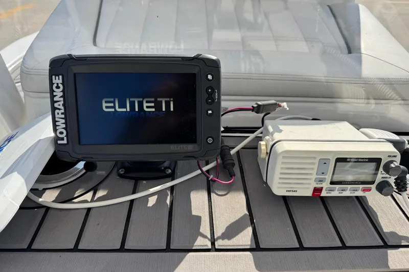 Slide: The Image of Lowrance Elite Ti and West Marine VHF radio on 2018 Yamaha Boats 210 FSH. - 17