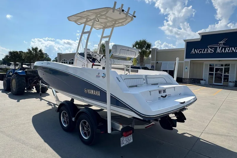 Slide: The Image of 2018 Yamaha Boats 210 FSH at Anglers Marine dealership, parked on a trailer. - 4