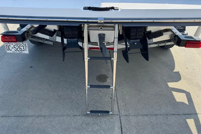 Slide: The Image of 2018 Yamaha Boats 210 FSH with ladder and North Carolina license plate. - 6