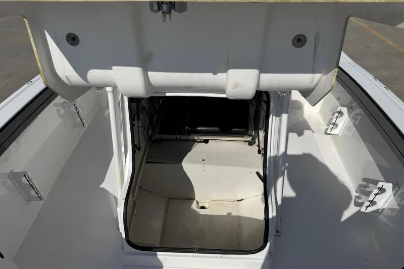 Slide: The Image of Open storage compartment on 2018 Yamaha Boats 210 FSH, showcasing interior space. - 9