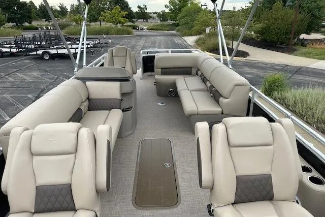 Slide: The Image of 2025 Sun Tracker Sportfish 24 XP3 pontoon boat with spacious seating and modern design. - 3