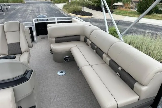Slide: The Image of 2025 Sun Tracker Sportfish 24 XP3 pontoon boat with spacious seating and modern design. - 4