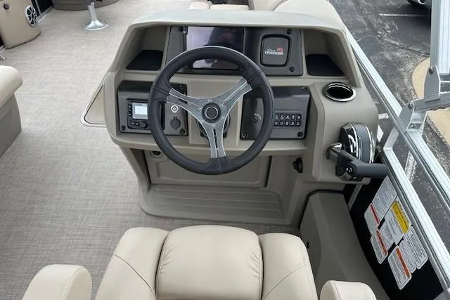 Slide: The Image of 2025 Sun Tracker Sportfish 24 XP3 boat dashboard with steering wheel and control panel. - 8
