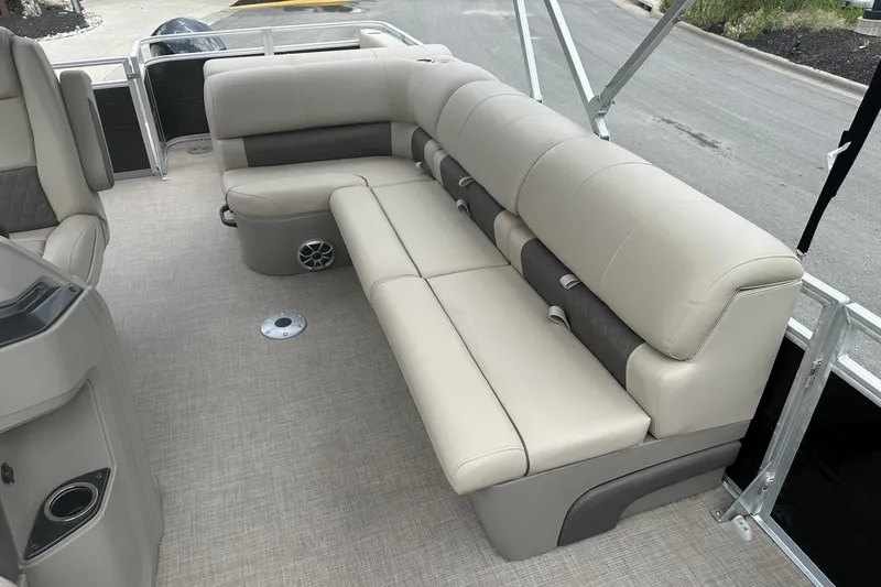 Slide: The Image of 2025 Sun Tracker Sportfish 24 XP3 boat interior with beige seating and modern design. - 21