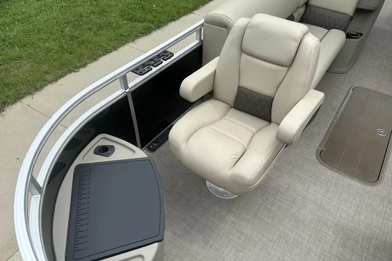 Slide: The Image of Luxurious seating on 2025 Sun Tracker Sportfish 24 XP3 pontoon boat, featuring beige upholstery. - 10