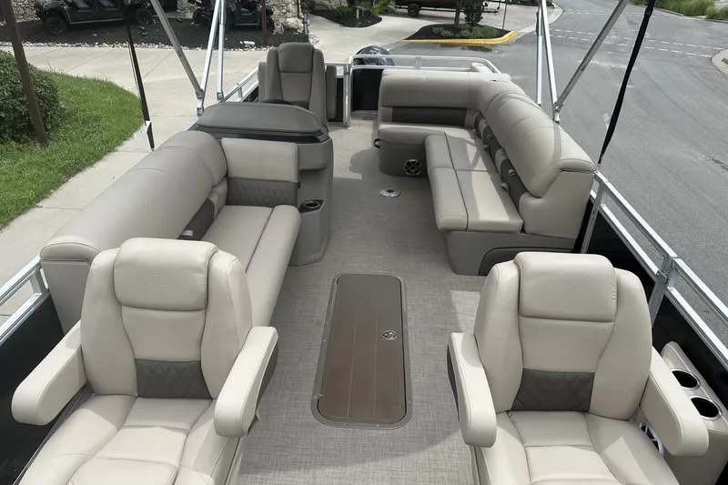 Slide: The Image of 2025 Sun Tracker Sportfish 24 XP3 pontoon boat interior with luxurious seating and spacious layout. - 7