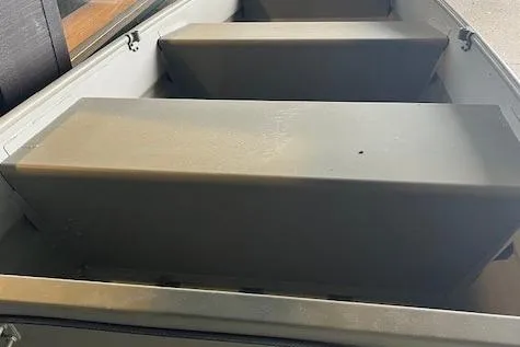 Slide: The Image of 2026 Tracker Grizzly 10 Jon boat interior with bench seats. - 2