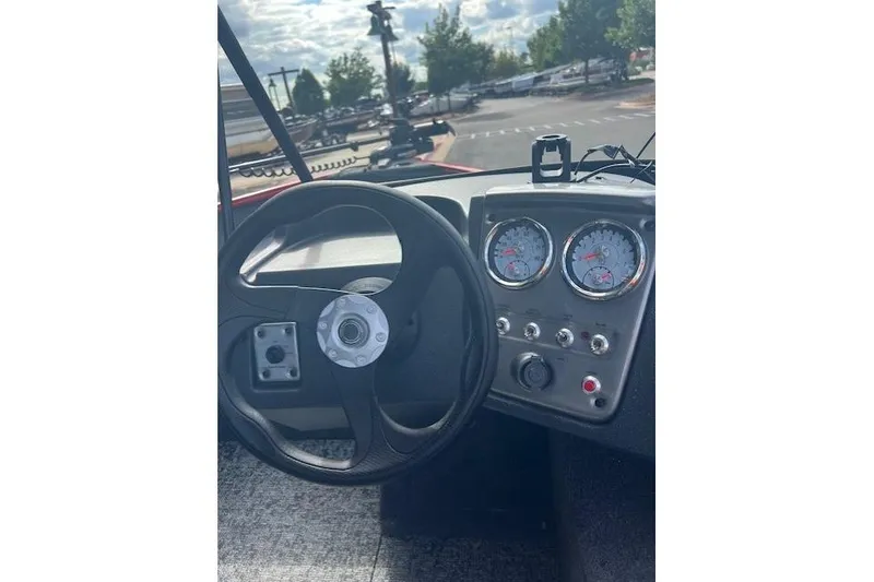 Slide: The Image of 2026 Tracker Pro Guide V-16 WT dashboard with steering wheel and gauges. - 5