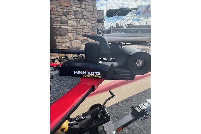 Slide: The Image of Minn Kota PowerDrive on 2026 Tracker Pro Guide V-16 WT boat, outdoor setting. - 6