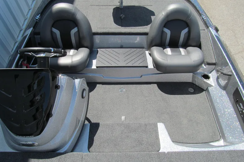 Slide: The Image of Interior of a 2026 Nitro Z17 boat featuring dual gray seats and steering console. - 10
