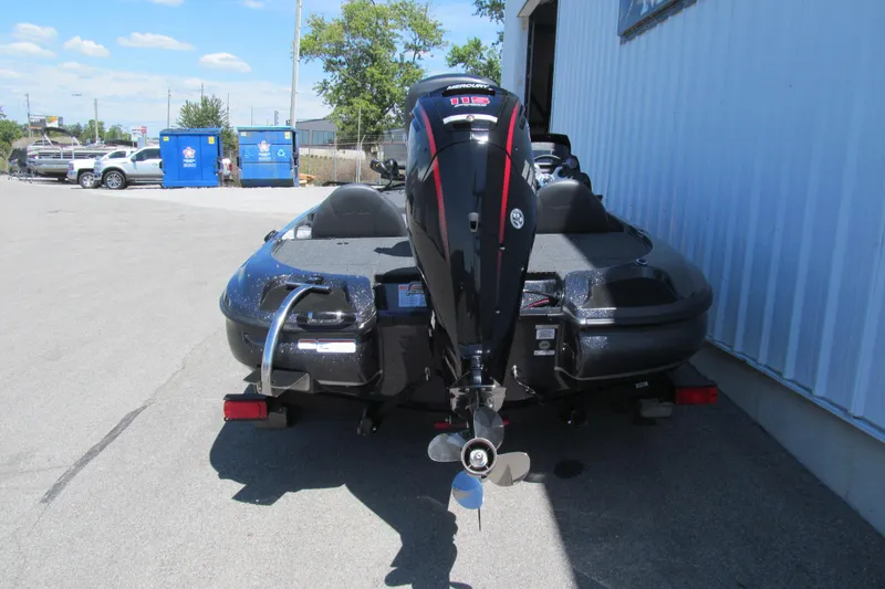 Slide: The Image of 2026 Nitro Z17 boat with powerful outboard motor, parked outdoors. - 3